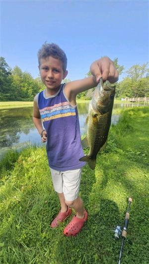 A student with a fish they caught