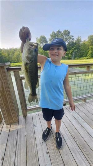 Student with a fish they caught