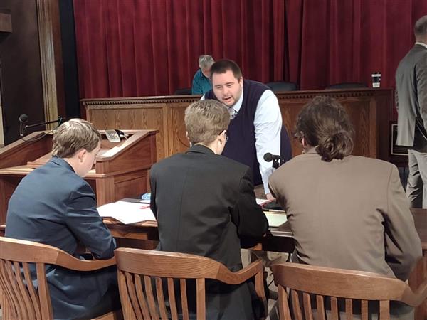 Mr. McNeill talking with members of the Mock Trial Team